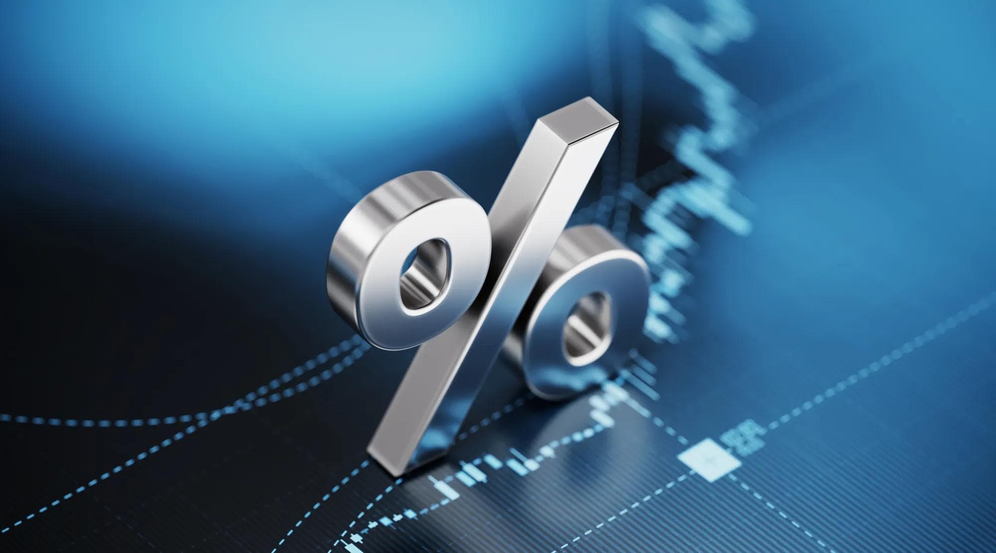 Image showing a 3D percentage sign in silver on a deep blue background that has stock charts behind it