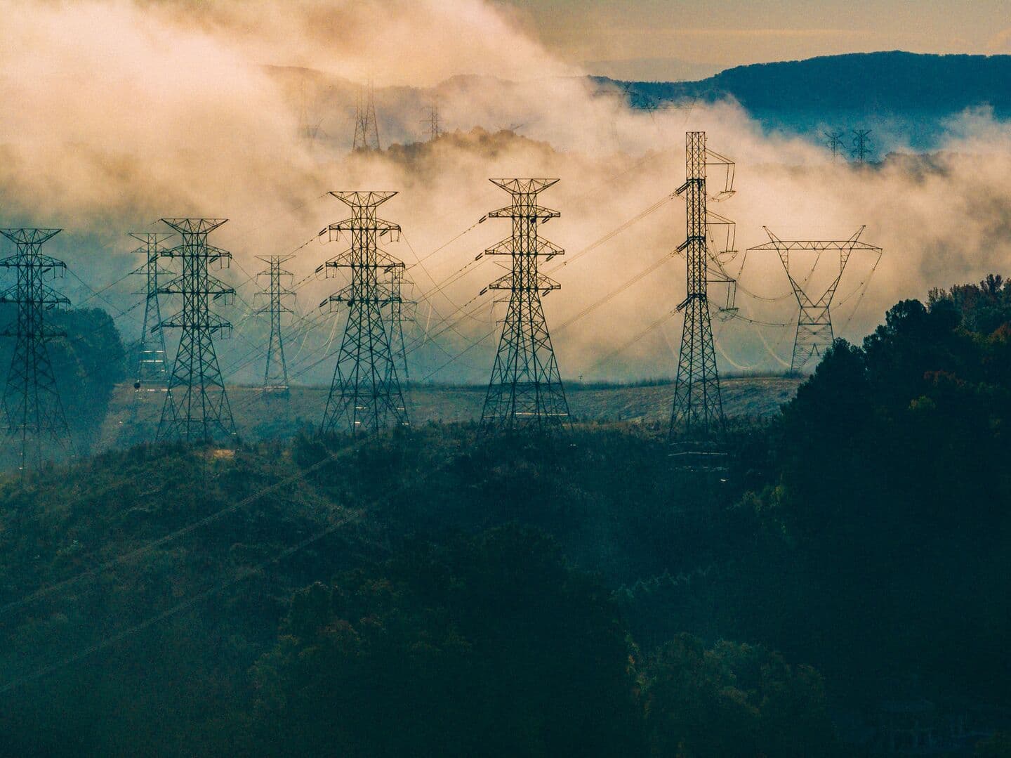 An aerial view of lattice steel electrical power lines from a power plant in Tennessee.