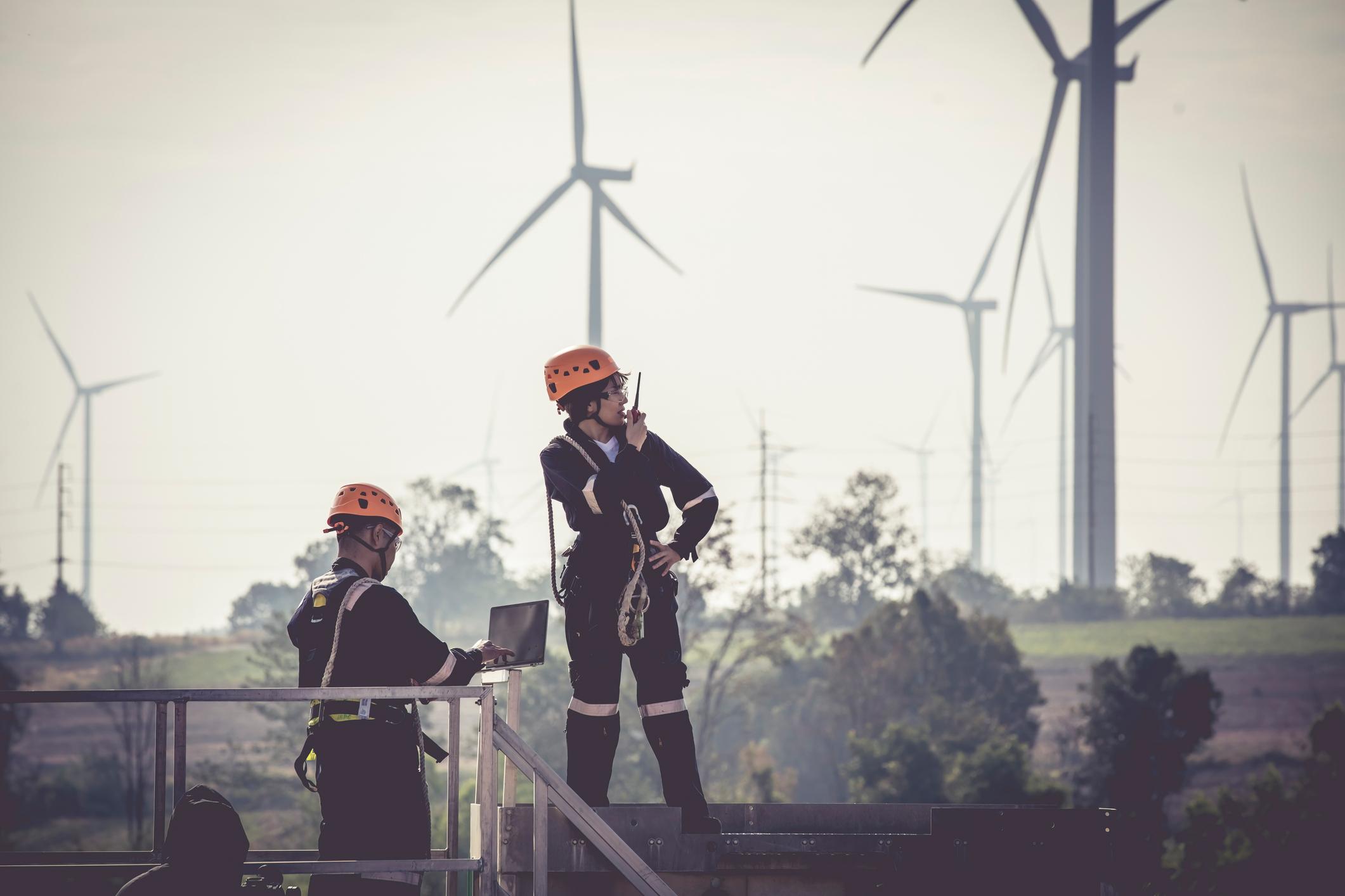 Close up professional wind turbine maintenance team