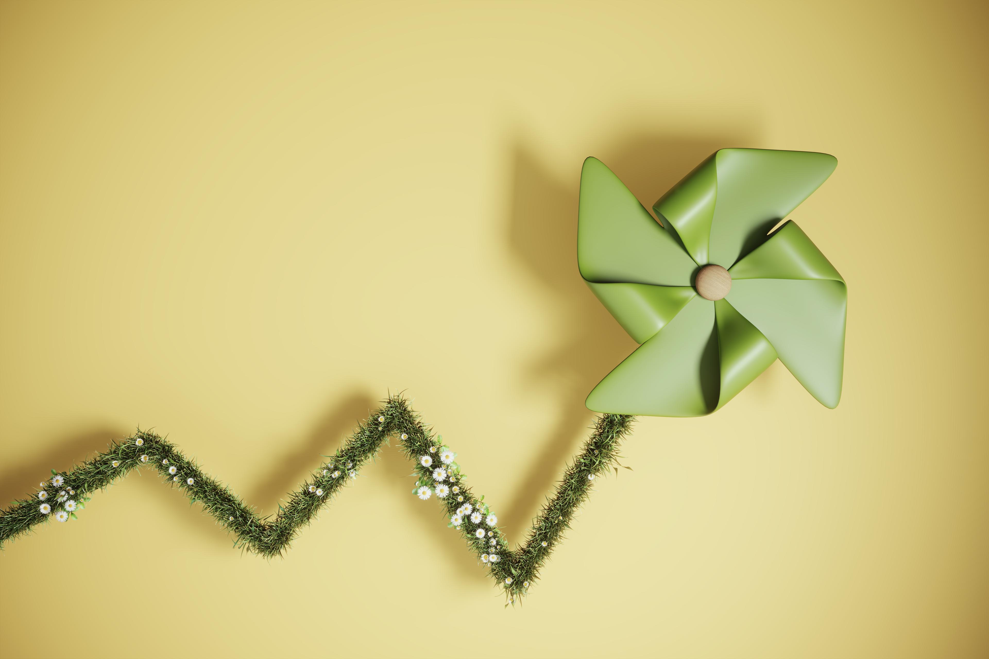 ESG concept with wind turbine paper and grassy chart